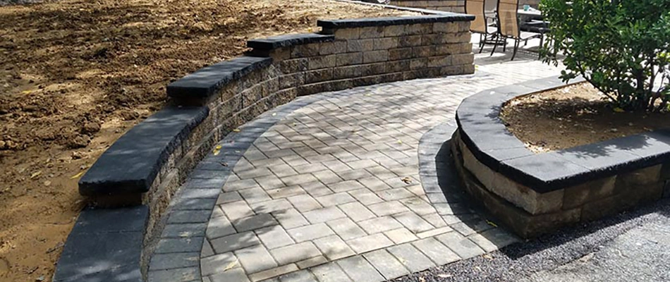 A retaining wall being built in a backyard in Glenmoore, PA.