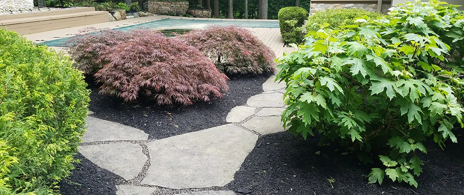 Pavers installed to build walkway between landscape beds in Coatesville, PA.